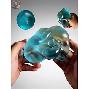 May include: A white ceramic mug with a black handle and the text "But First, Coffee" in a bold, black font. The mug is set against a blurred background, suggesting a cosy setting.