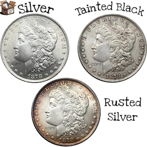 Puede incluir: Tres monedas de plata con el texto "COPY" y el año "1878". Las monedas están etiquetadas como "Silver", "Tainted Black" y "Rusted Silver". Las monedas tienen el perfil de una mujer.
