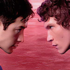 May include: Two young men face each other in a close-up shot, their profiles visible. The background is a textured red surface. One man has dark hair and is wearing a blue shirt. The other has curly hair and a dark shirt.