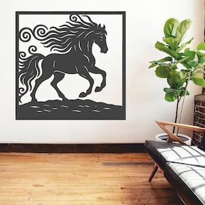 May include: A dark gray, laser-cut metal wall art piece featuring a running horse silhouette within a square frame. The horse has a flowing mane and tail, and is depicted on a textured ground. The artwork is mounted on a white wall.
