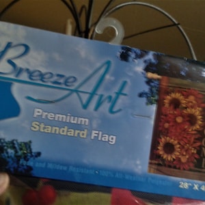May include: A welcome garden flag featuring a sunflower design. The flag measures 28 inches by 40 inches and is made from fade and mildew resistant polyester. The flag is from Breeze Art.