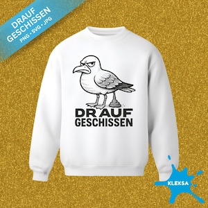 May include: White sweatshirt featuring a black and white illustration of an angry seagull with the text "DRAUF GESCHISSEN" below. The sweatshirt has a crew neck and long sleeves. The image also includes the text "PNG • SVG • JPG".
