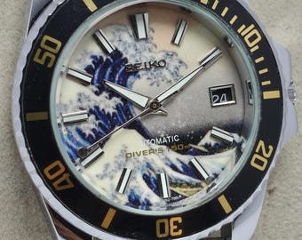 Seiko automático vintage con esfera azul, fecha, revisado y en buen estado de funcionamiento.