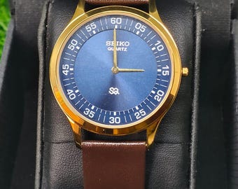 Reloj de pulsera vintage Seiko Slim Tank Style de cuarzo para hombre, con correa de cuero.