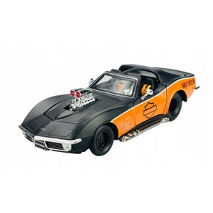 May include: A black and orange model car with the words "Harley Davidson" on the side. The car has a large engine and chrome exhaust pipes. The car is a classic Corvette style.