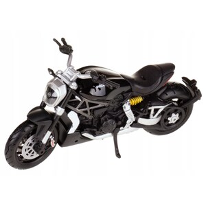 May include: A black Ducati motorcycle model with silver accents. The model features a detailed design, including a black seat, yellow suspension, and a silver headlight. The motorcycle has a sleek, modern appearance.