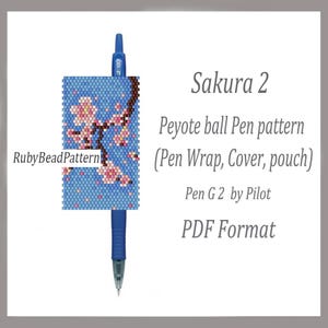 May include: A blue pen with a beaded pen wrap featuring a cherry blossom design. The wrap has a blue background with pink and white flowers. Text on the image reads "Sakura 2" and "Peyote ball Pen pattern".