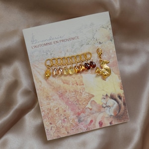 L'AUTOMNE EN PROVENCE - Glittriga stickningsmaskörer, set med 10 st – Höstinspirerade handgjorda maskörer och framstegsguide