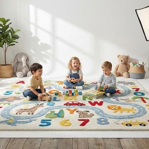May include: A colorful children's rug with a road design, numbers, and animal illustrations. Three children are playing on the rug with toys. Baskets with stuffed animals and a photographer are in the background.