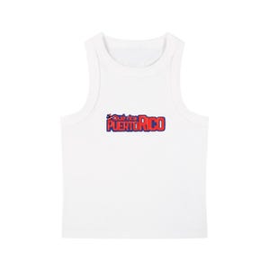 May include: A white sleeveless tank top featuring a graphic print on the chest. The text reads Qué rico PUERTO RICO in red letters with a blue outline, accompanied by a small graphic of a Puerto Rican flag icon above the word rico.