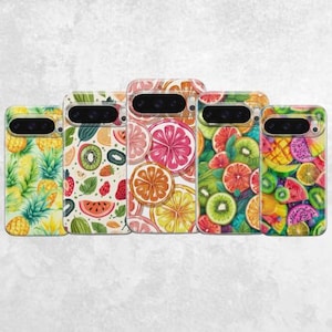May include: Five phone cases with vibrant fruit patterns. The cases display illustrations of pineapples, kiwi fruit, strawberries, oranges, grapefruit, and watermelon. The cases have a glossy finish and are arranged in a row.