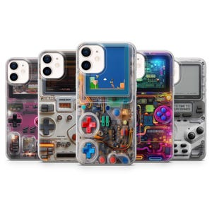 May include: Five clear phone cases with retro video game designs. Each case features a different design, including circuit board patterns and pixelated game scenes. The cases have a transparent design, allowing the phone's color to show through.