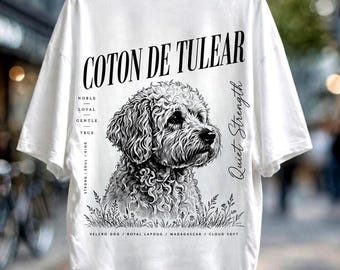 May include: A white t-shirt featuring a black ink-style illustration of a Coton de Tulear dog. The text reads Coton de Tulear, Noble, Loyal, Gentle, True, Strong, Soul, Kind, Quiet Strength, Velcro Dog, Royal Lapdog, Madagascar, and Cloud Soft.