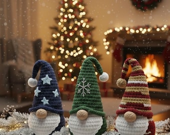 May include: Three handmade Christmas gnomes with white beards and round noses. One gnome has a navy blue hat with white stars, another has a green hat with a snowflake, and the third has a red and gold striped hat. The gnomes are on a snowy surface.