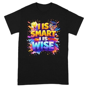 May include: Black t-shirt with a colorful graphic design. The design features the words "I IS SMART I IS WISE" in bold, vibrant letters, along with an owl wearing a graduation cap and a lightbulb.