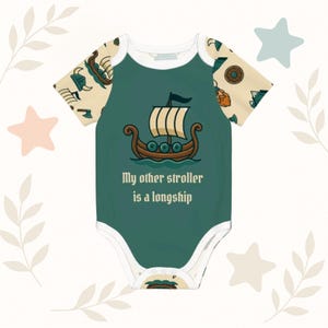 May include: A teal baby onesie with a cartoon longship illustration and the text "My other stroller is a longship." The sleeves have a cream-colored pattern with Viking ship and shield designs. The onesie has white trim.