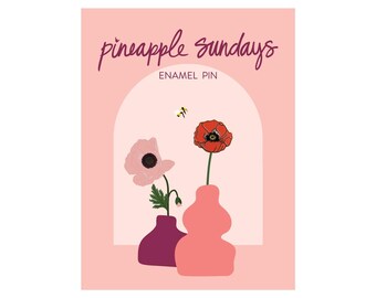 May include: Enamel pin featuring a pink and red poppy flower arrangement in two vases. The text "pineapple sundays" and "enamel pin" are at the top of the image.