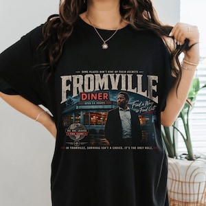 a woman wearing a Vintage Fromville Diner Graphic Tee from the FROM series | Retro Sci-Fi Mystery Shirt | 90s Bootleg Horror TV Apparel | Oversized Comfort Colors T-Shirt