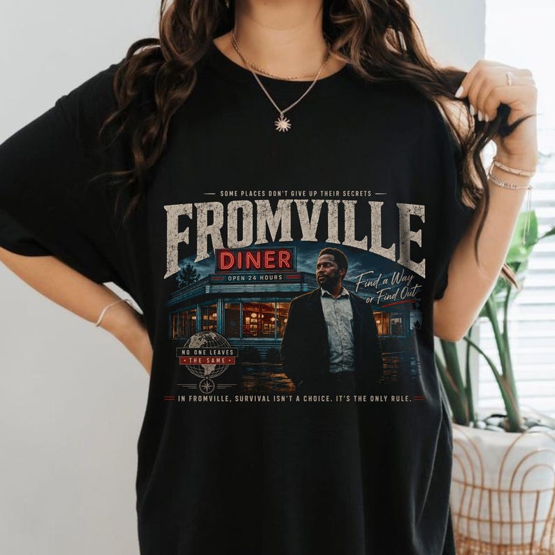 a woman wearing a Vintage Fromville Diner Graphic Tee from the FROM series | Retro Sci-Fi Mystery Shirt | 90s Bootleg Horror TV Apparel | Oversized Comfort Colors T-Shirt