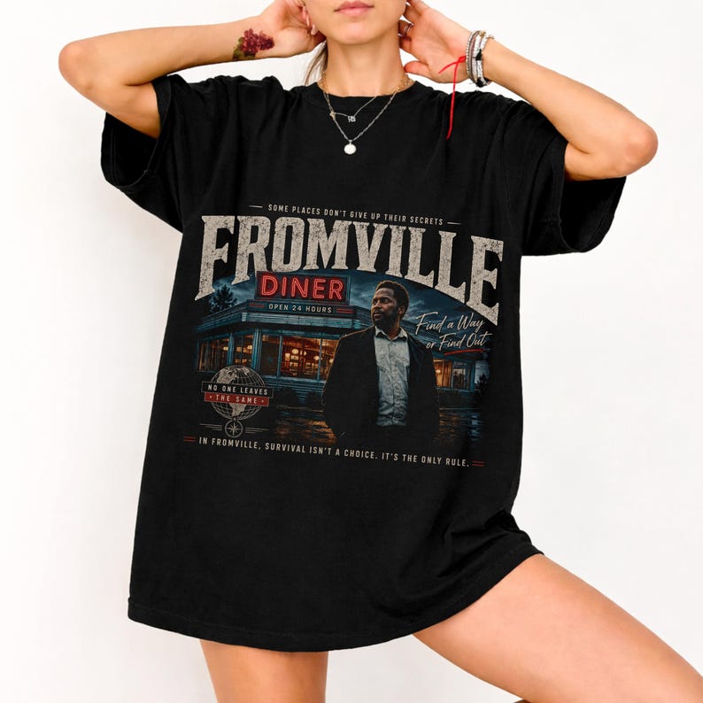 a woman wearing a Vintage Fromville Diner Graphic Tee from the FROM series | Retro Sci-Fi Mystery Shirt | 90s Bootleg Horror TV Apparel | Oversized Comfort Colors T-Shirt