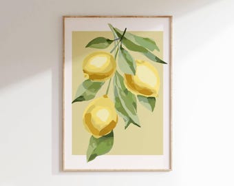 May include: A framed art print featuring a branch of lemons with green leaves. The lemons are yellow, and the leaves are green. The background is a light yellow color. The frame is a light brown color.