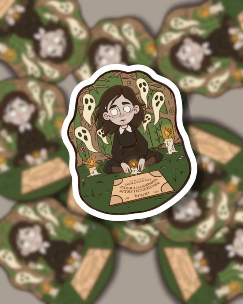May include: A sticker depicting a person in a black dress, surrounded by ghosts and candles, with a Ouija board. The design has a spooky, mystical theme, with a forest background and the word "Ouija" visible on the board.
