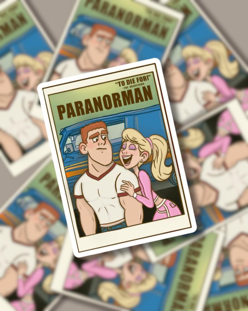 May include: A sticker featuring a cartoon image from the film "ParaNorman." The sticker is rectangular with a white border. The image shows a man and woman with the text "TO DIE FOR!" and "PARANORMAN". The background is blue.