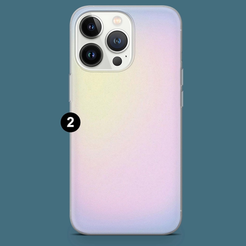 May include: A gradient phone case with a soft, pastel color scheme. The case transitions from yellow to pink to purple. The phone case has a clear border and a camera cutout with three lenses and a flash.