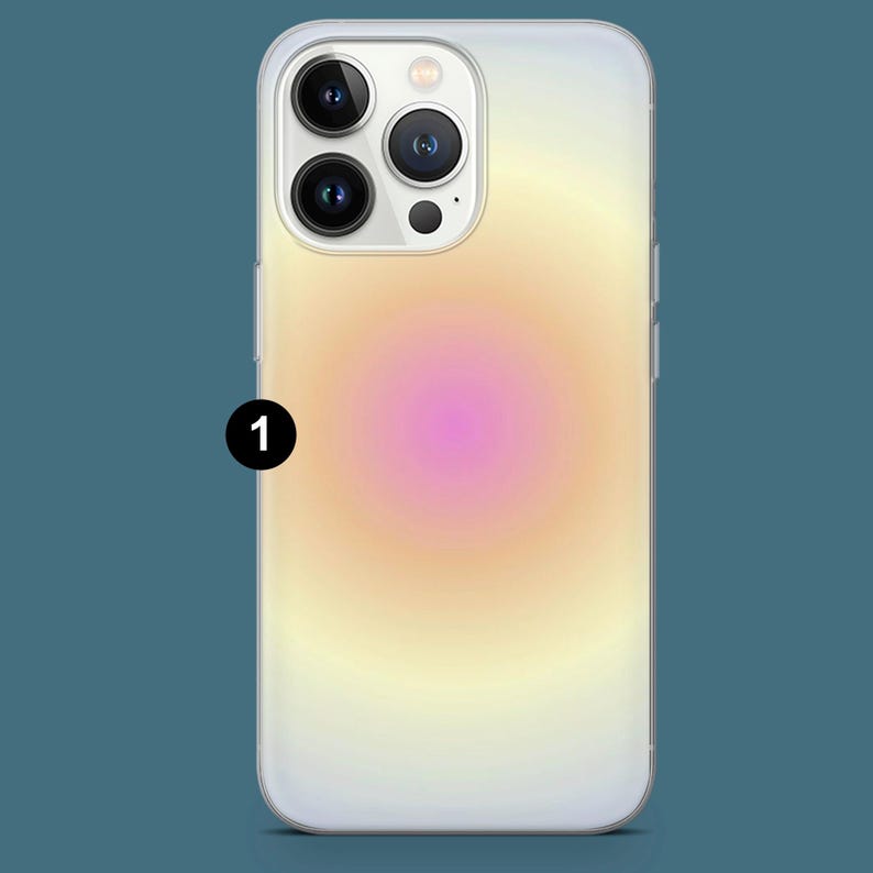 May include: A clear phone case with a gradient design. The design transitions from a pink center to yellow and white edges. The phone case has a camera cutout and side buttons.