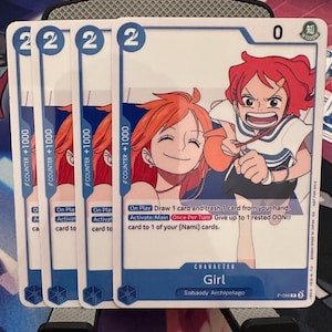 May include: Four trading cards featuring a red-haired anime character. Each card has a blue border with the number "2" in the top corners. The cards display the text "COUNTER +1000" and "Girl" with the text "Sabaody Archipelago".