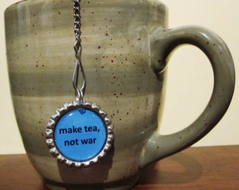 Tea Infuser - make tea, not war 2" and Bottle Cap Charm - Mesh Tea Ball