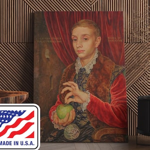 May include: A canvas print of a Renaissance-style portrait featuring a young person holding a green apple. The subject wears a red jacket, a fur-trimmed vest, and a detailed patterned shirt. The artwork is set against a backdrop of a red curtain and wooden paneling. The print is labeled "MADE IN U.S.A."