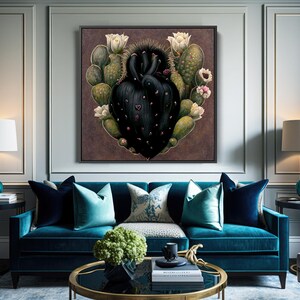 May include: A framed artwork featuring a black heart-shaped cactus surrounded by green cacti and white flowers. The artwork hangs above a teal sofa with teal and navy blue pillows. Two teal lamps with white shades flank the sofa.