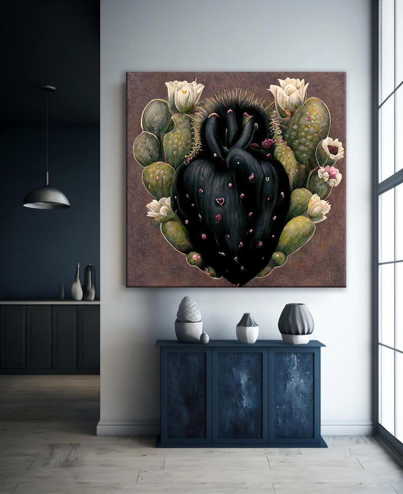 May include: A large square canvas art piece featuring a black cactus heart surrounded by green cacti and white flowers. The artwork hangs above a dark blue cabinet with decorative vases.