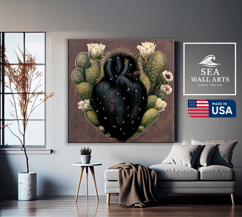 May include: A canvas wall art piece featuring a heart-shaped cactus design with a dark center and green and white accents. The artwork includes white flowers and small pink details. The image also includes the text "SEA WALL ARTS HOME DECOR" and "MADE IN USA".