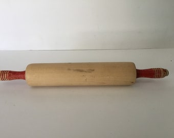Vintage wooden rolling pin with chippy red handles