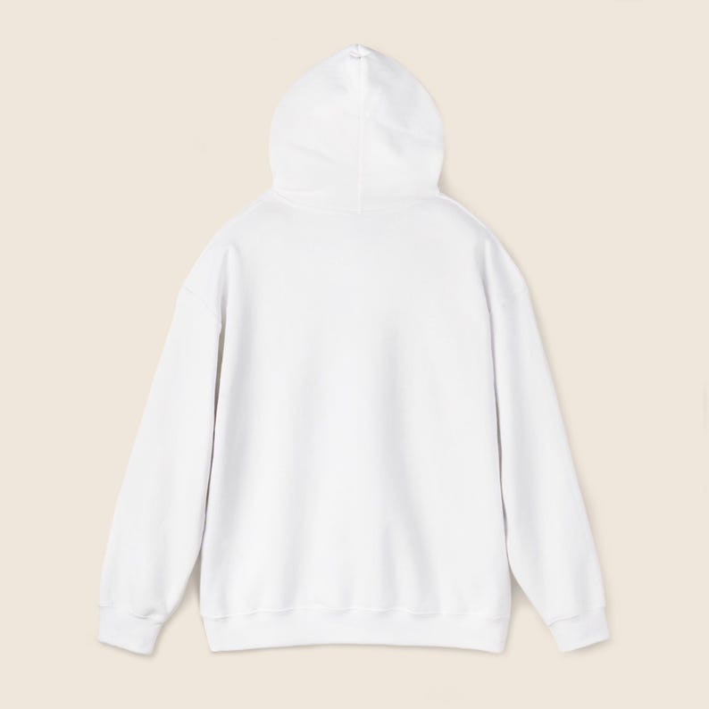 May include: A white hoodie with a drawstring hood. The back view of the sweatshirt shows the hood and the long sleeves. The hoodie is made of a soft, comfortable material.