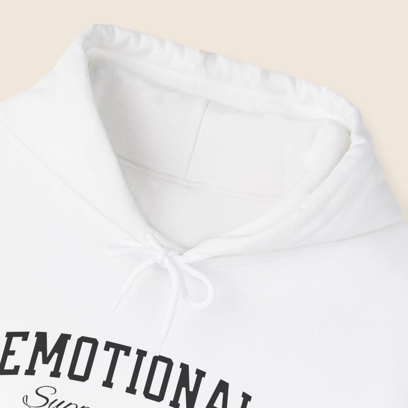 May include: White hoodie with a drawstring and a hood. The text "EMOTIONAL Support" is printed in black on the front. The hoodie is made of a soft material.