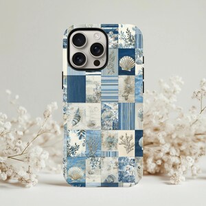 May include: A phone case with a patchwork design featuring seashells, coral, and botanical elements in shades of blue and white. The case has a glossy finish and a camera cutout.