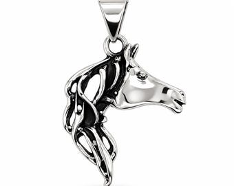 May include: A silver-toned metal pendant shaped like a horse head in profile. The design features a polished finish on the horse's face and neck, with dark, recessed areas highlighting the flowing, stylized mane and facial features.