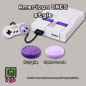 May include: A white Super Nintendo Entertainment System (SNES) console with a matching controller and two purple accessories. The text "American SNES style" is displayed above the console. The accessories are labeled "Purple" and "Light Purple".