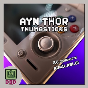 May include: A light grey thumbstick replacement for an AYN Thor handheld gaming console. The thumbstick features a circular, textured top surface. The image includes the text AYN THOR THUMBSTICKS and 20 COLOURS AVAILABLE, along with a D3D Prints logo.