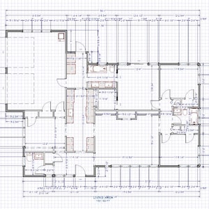 May include: Architectural blueprint of a residential floor plan, with detailed room layouts, dimensions in feet and inches, and the words "Living Area" with a square footage measurement. The plan is drawn in black lines on a grid background.