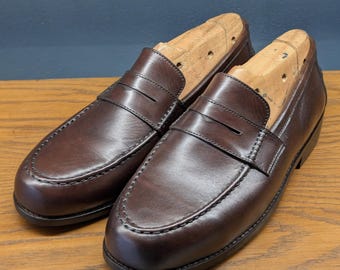 Handgemaakte donkerbruine klassieke penny-loafers – luxe instappers voor heren