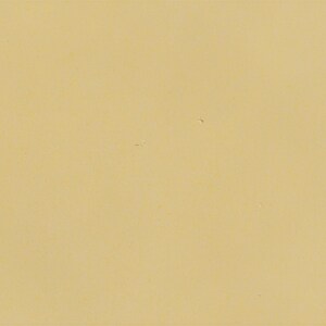 The image is a plain yellow background with no discernible objects or text.