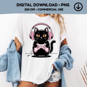 May include: Digital download PNG featuring a black cat wearing pink headphones and holding a pink game controller. The cat has yellow eyes and a cute expression. The text "DIGITAL DOWNLOAD • PNG" and "300 DPI • COMMERCIAL USE" is at the top.