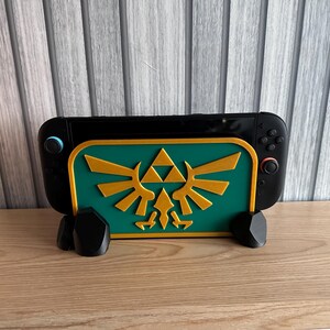 Nintendo Switch 2 Legend of Zelda Hylian Crest dockningsställ/fodral