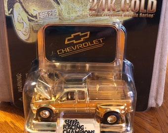 FACTORY ERROR Racing Champions Ford 24K in a Chevrolet advertisement package. Never opened!
