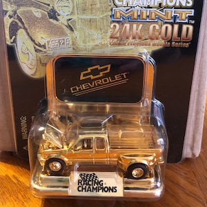 FACTORY ERROR Racing Champions Ford 24K in a Chevrolet advertisement package. Never opened!