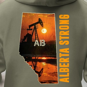 May include: Olive green hoodie featuring a sunset scene within an outline of Alberta, Canada. The image includes a silhouette of an oil pump jack and the text "AB" and "ALBERTA STRONG" in orange.